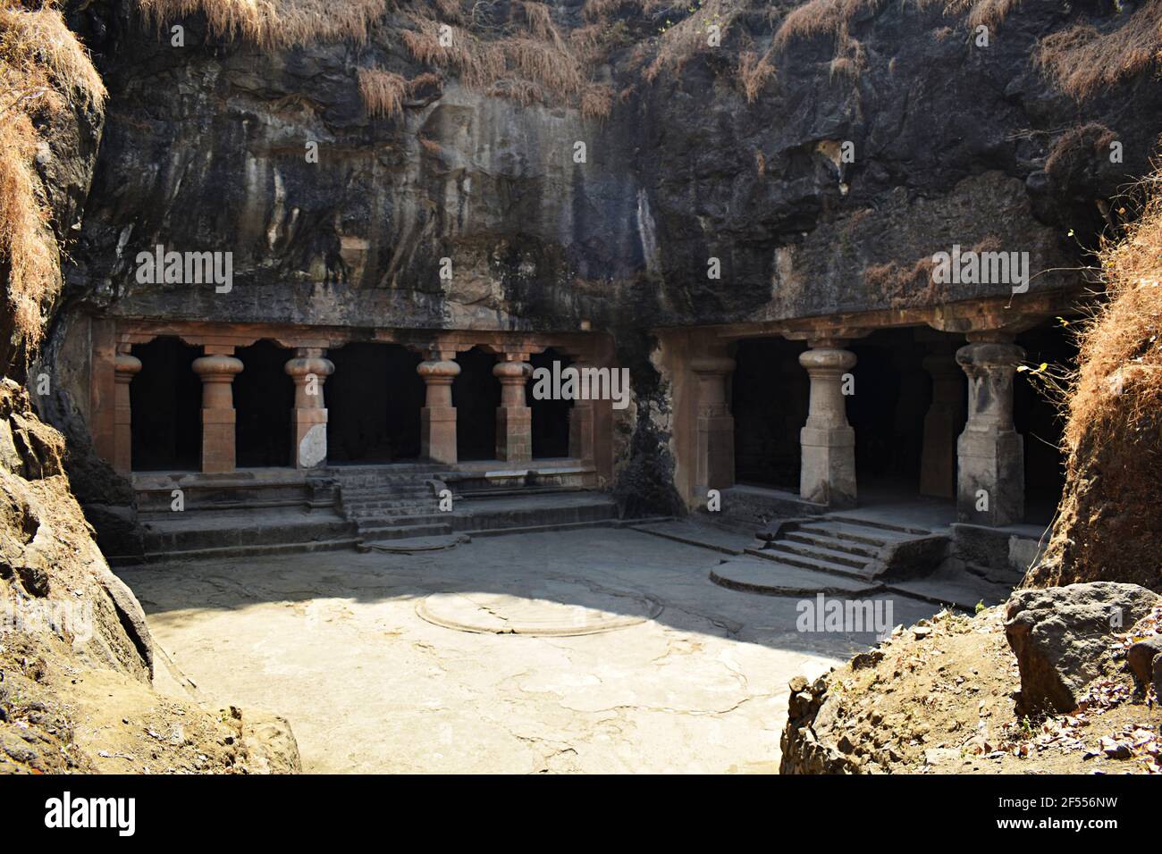 Eastern entrance of main cave (right) and entrance of the eastern wing shrine, cave 1, Elephanta Caves, at Elephanta Island or Gharapuri, Mumbai, Maha Stock Photo