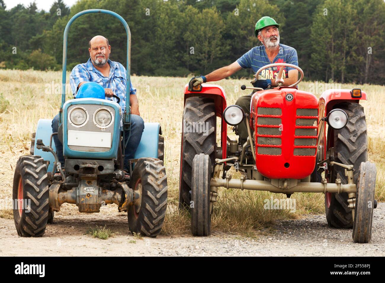 Two Czech farmers on tractors, Zetor 25 and Eicher Stock Photo