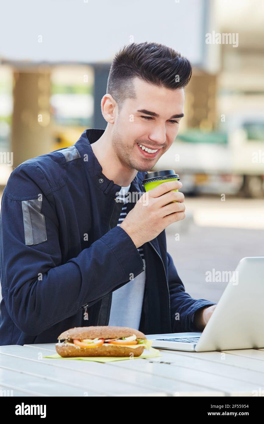 Man laptop computer sandwich hi-res stock photography and images - Alamy