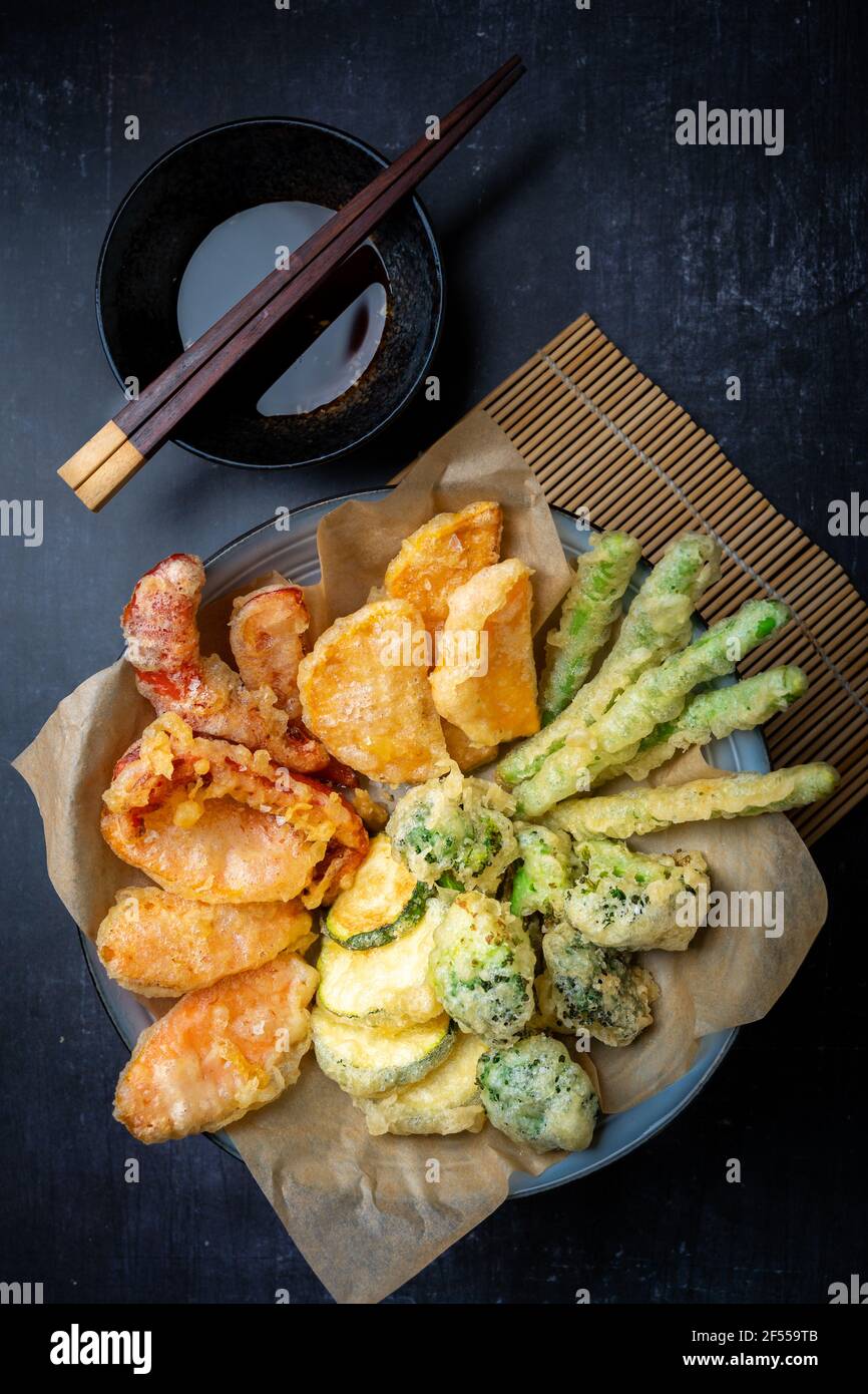 Flatlay of Japanese vegetable tempura with ginger ponzu dipping sauce