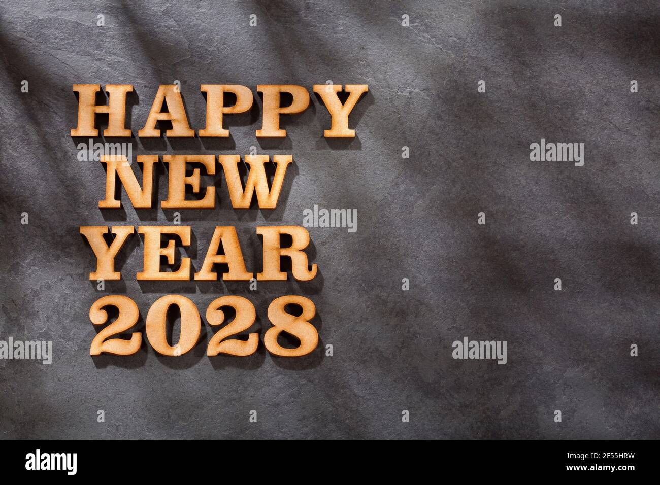 Happy new year 2028 in wooden letters - Text space Stock Photo