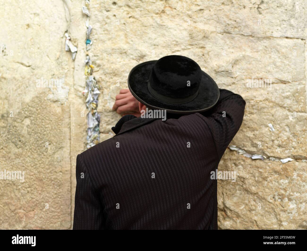 Israel Jerusalem Western Wall or Wailing Wall with worshipper Stock Photo