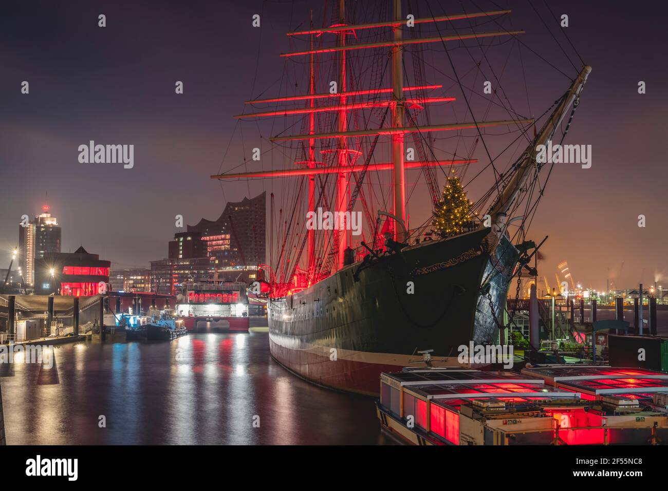 Germany, Hamburg, Museum ship with Christmas tree and Elbe Philharmonic Hall in background Stock Photo