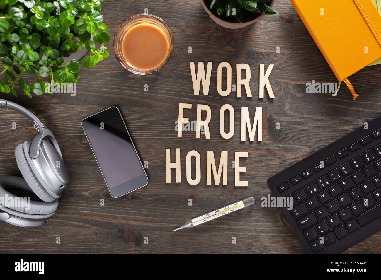 Work From Home Text Design work from home text desk with keyboard computer smartphone notebook ...