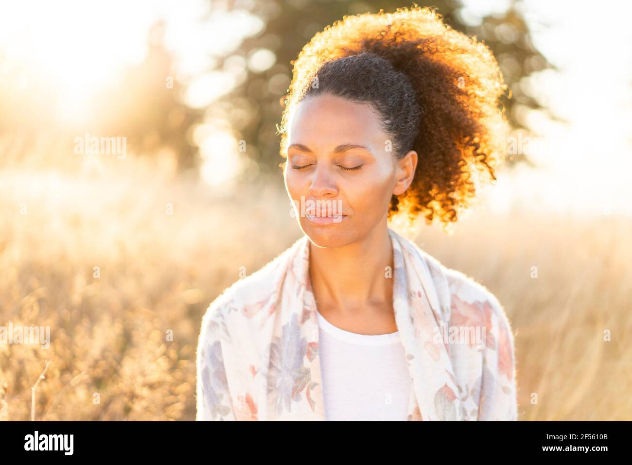 Woman curly brown hair eyes hi-res stock photography and images - Alamy