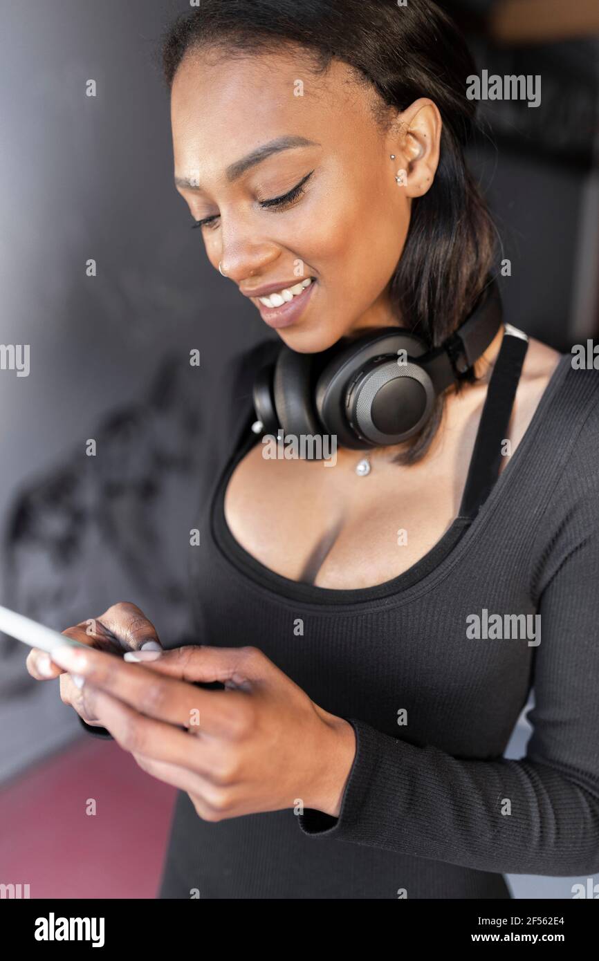 Gym headphones woman hi-res stock photography and -