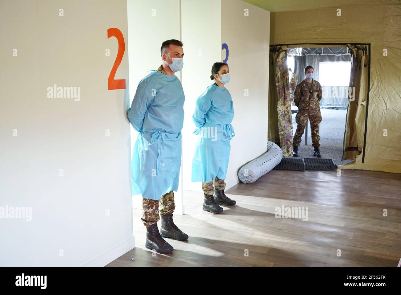 Hotspot for mass immunisation with three vaccination lines manned by army medical staff. Turin, Italy - March 2021 Stock Photo