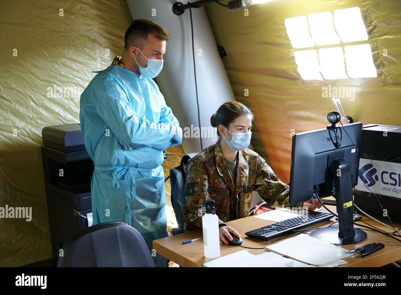 Hotspot for mass immunisation with three vaccination lines manned by army medical staff. Turin, Italy - March 2021 Stock Photo