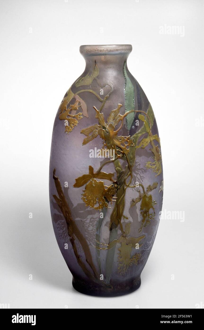 Vase 'Les Lumineuses' with a verse of Victor Hugo. The studies of East Asian glass art inspired the French artist Emile Gallé on the production of over-catchers, which today belong to the most beautiful and most important glass artworks of Art Nouveau. As a decor, the studied botanist chose predominantly motifs from the plant world and thus promoted the rich floral ornamentation, which is characteristic of the French Art Nouveau style. Gallé, who also made a name for exquisite furniture, represented the artistic claim to shape his glasses and furniture to talking objects. You should speak the Stock Photo