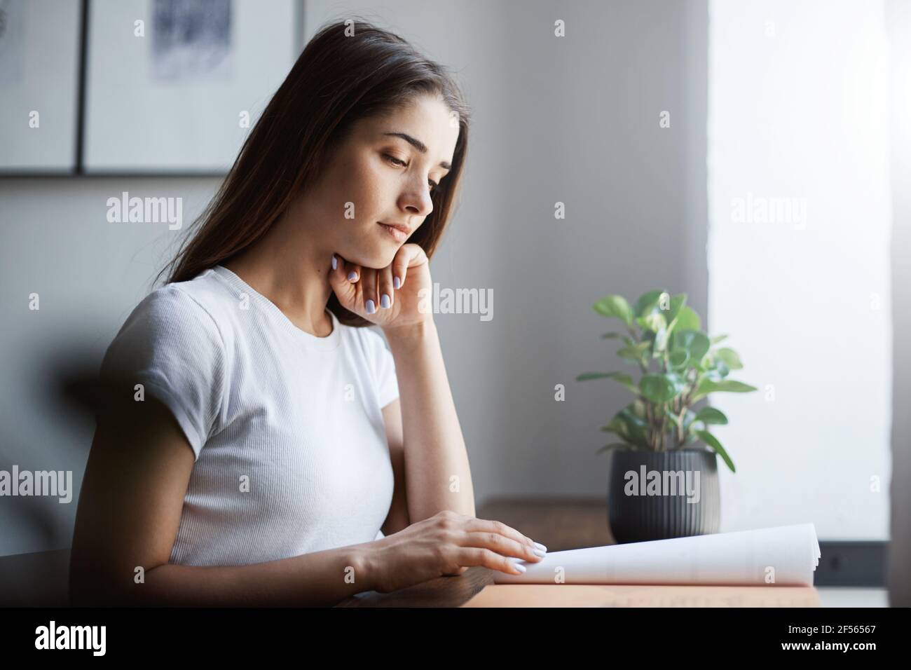 Young english student learning a language using offline work book