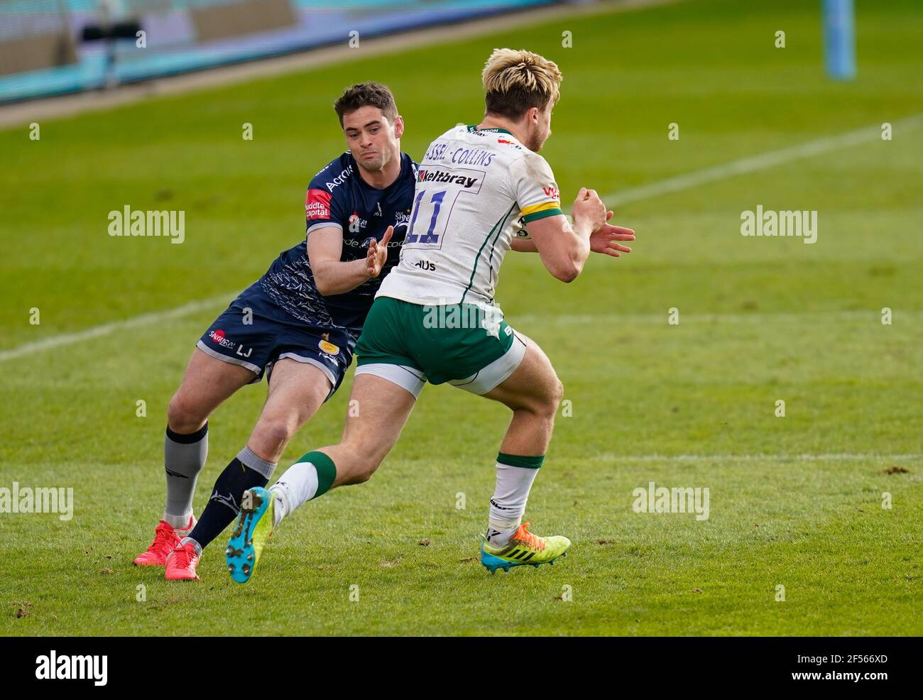 Sale Sharks Luke James tackles London Irish Wing Ollie Hassell-Collins during a Gallagher Premiership Round 14 Rugby Union match, Sunday, Mar 21, 2021 Stock Photo