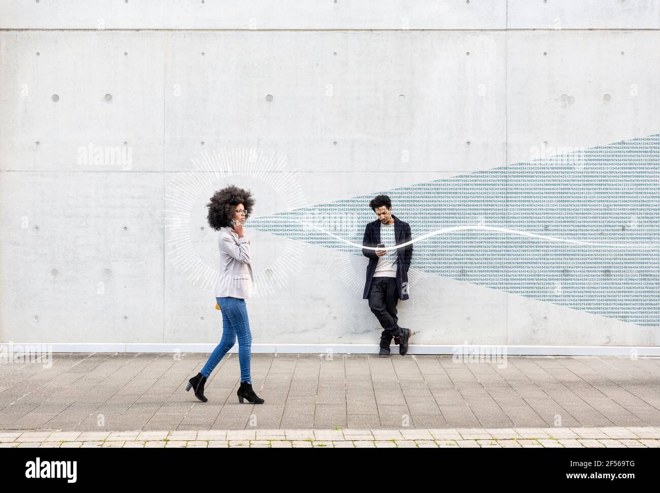 Graphic visualization of data exchanged by man and woman using smart phones outdoors Stock Photo