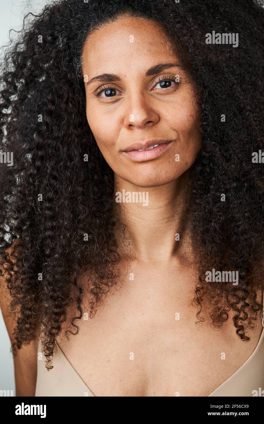 Beautiful smiling curly haired woman Stock Photo
