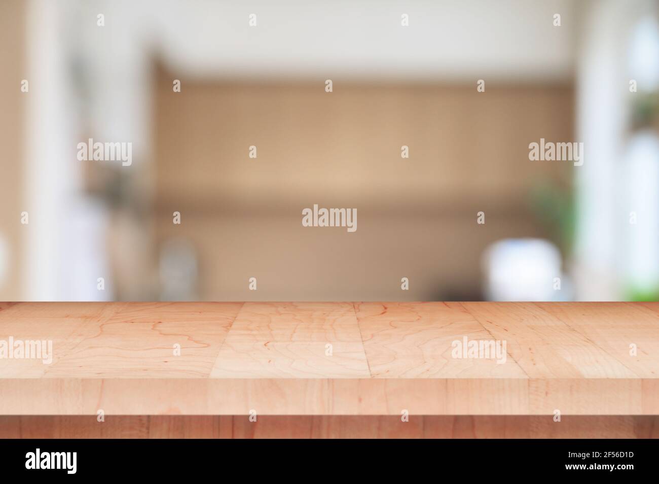 Abstract defocussed blurred background of empty wooden table and modern kitchen  background, product display. Stock Photo