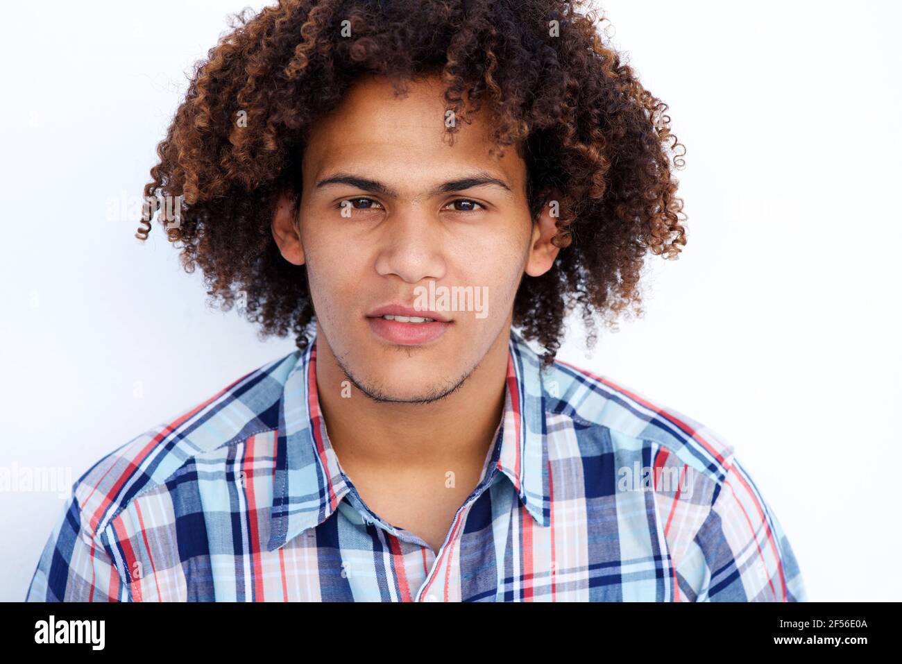 Close up portrait of mixed race man with curly hair against isolated white  background Stock Photo - Alamy