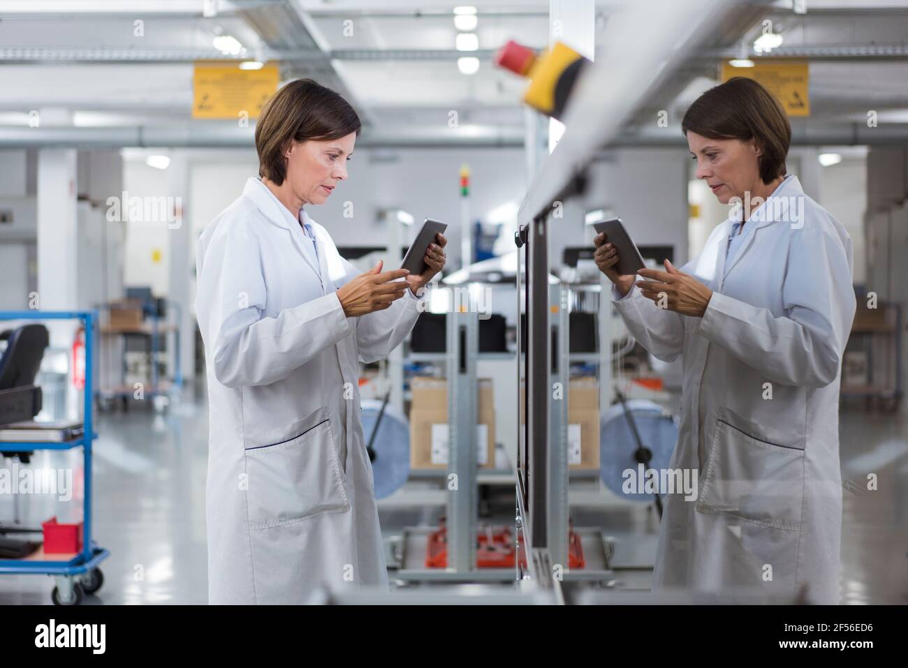 Female engineer using digital tablet at industry Stock Photo