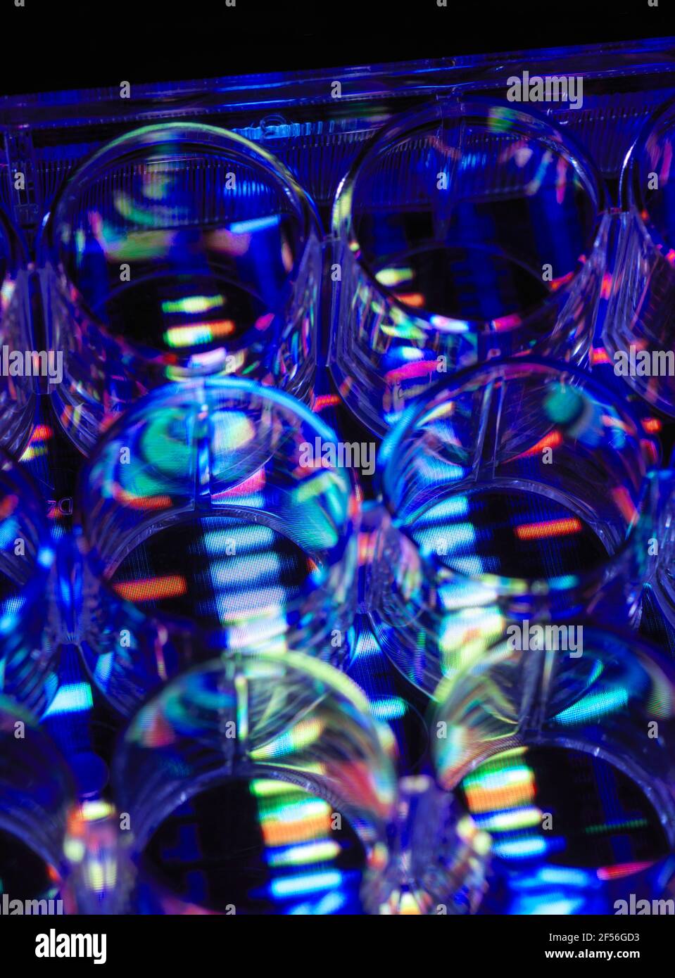 Multi well plate on illuminated multi colored reflection Stock Photo