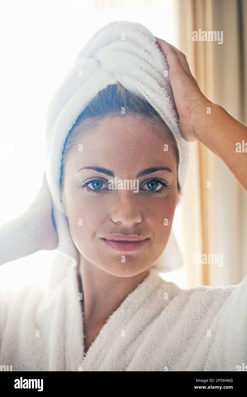Woman wearing bathrobe towel head hires stock photography and images