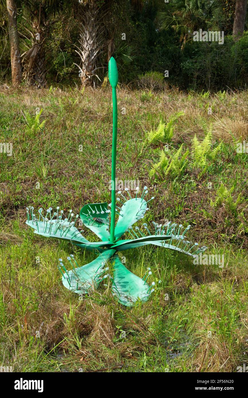 green sculpture, flower, insect, wetland area, art, Bok Tower Gardens, Florida, Lake Wales, Fl, spring Stock Photo