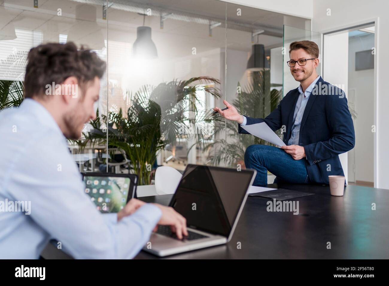 Team working desk using laptop hi-res stock photography and images - Alamy