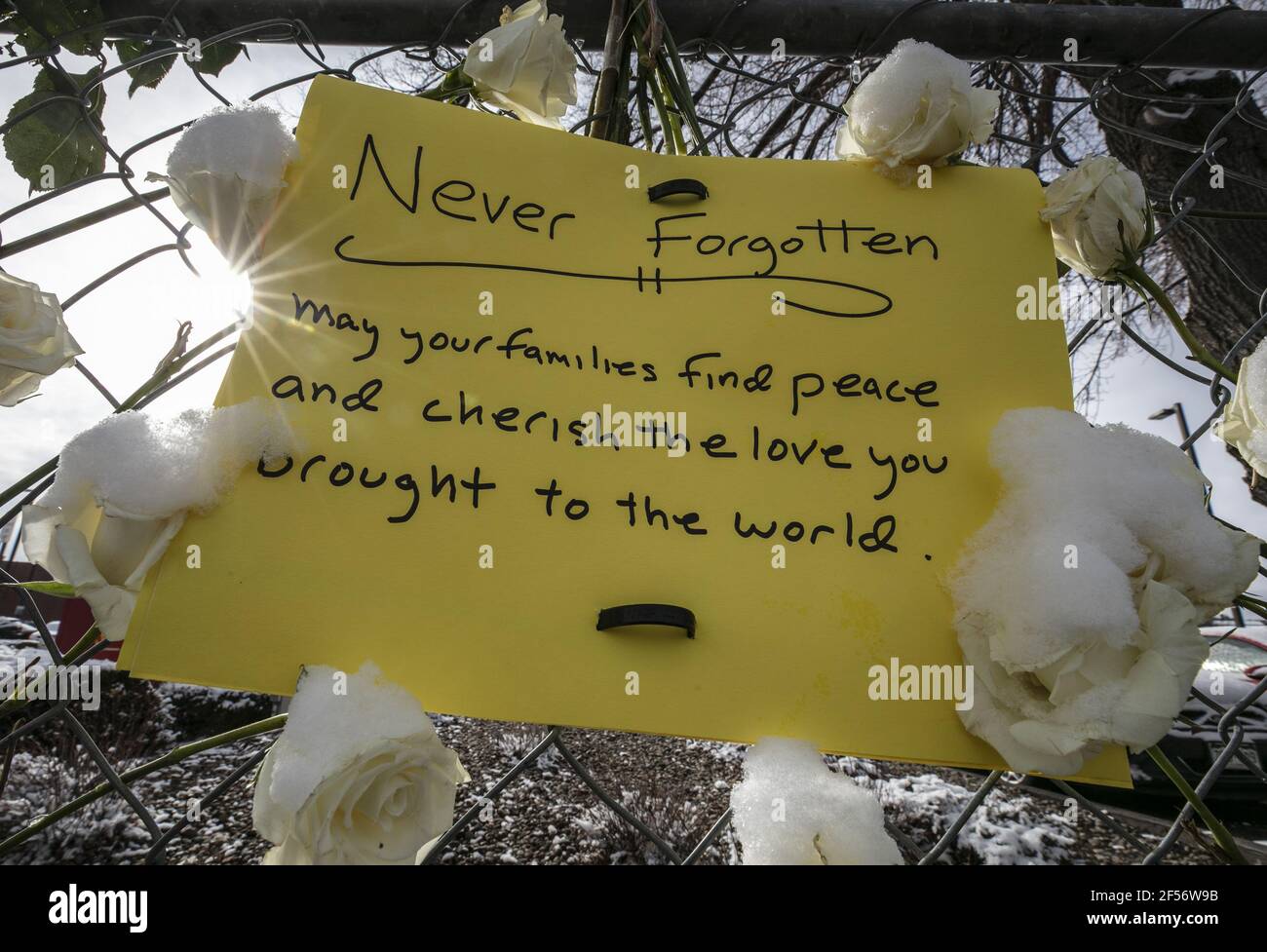 Boulder, United States. 24th Mar, 2021. Snow-covered roses ring a note placed outside the King Soopers grocery store after a Monday shooting there killed 10 people, including police officer Eric Talley, in Boulder, Colorado, on Wednesday, March 24, 2021. Police said the suspect, identified as Ahmad Al Aliwi Alissa, was in custody and had been charged with 10 counts of first degree murder. Photo by Bob Strong/UPI Credit: UPI/Alamy Live News Stock Photo