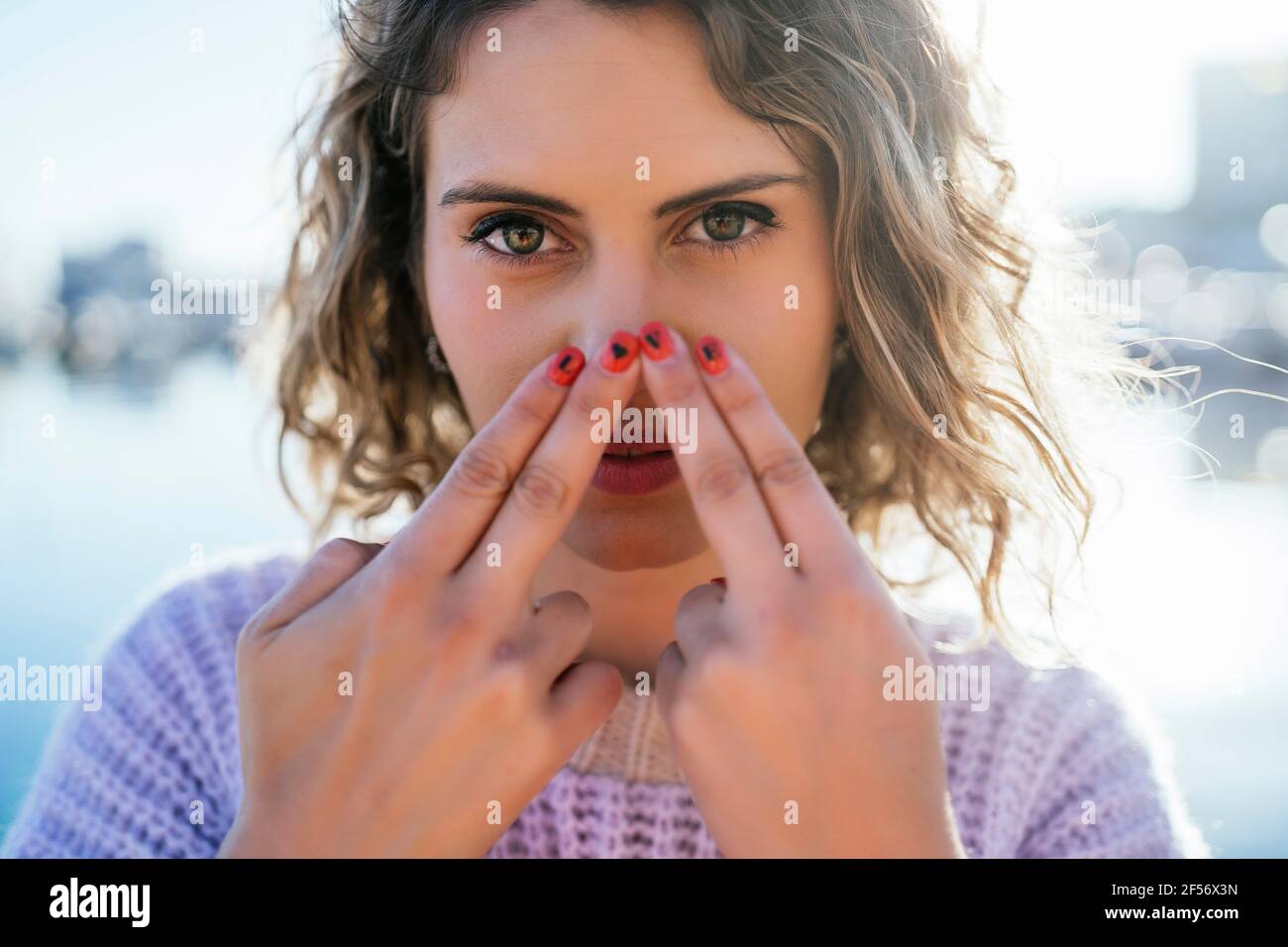 Finger on her nose hires stock photography and images Alamy