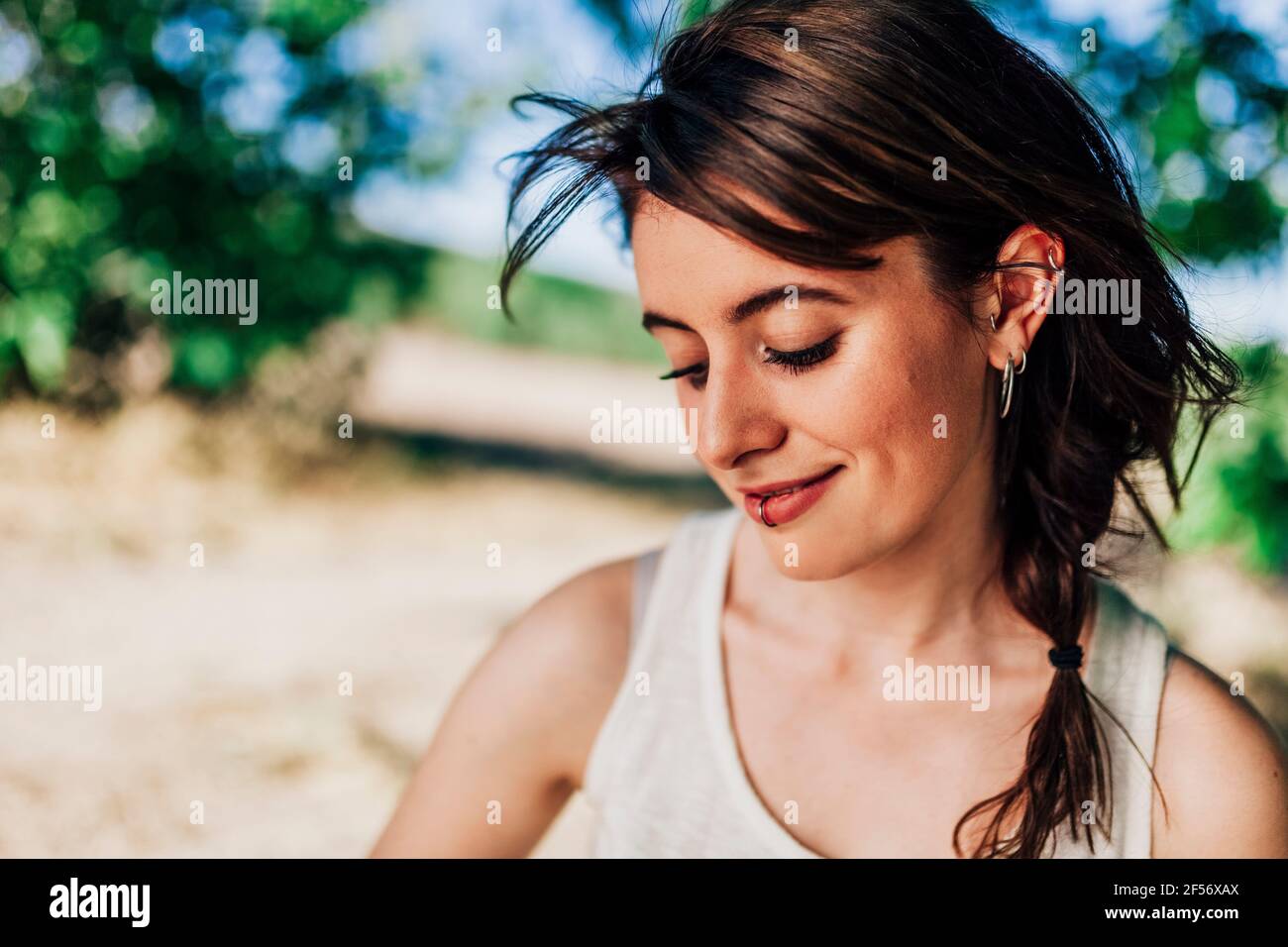 Close up of young woman in tank top Stock Photo