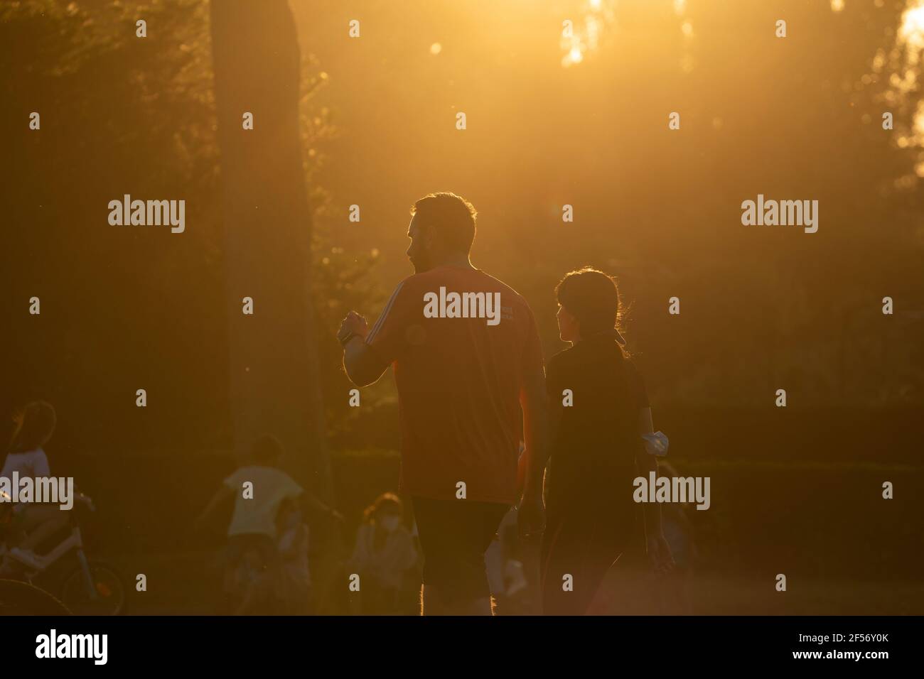 Madrid, Spain - June 20, 2020: A couple, a man and a woman, play sports, walk fast and run to keep fit and enjoy free time together, near the Rosaleda Stock Photo