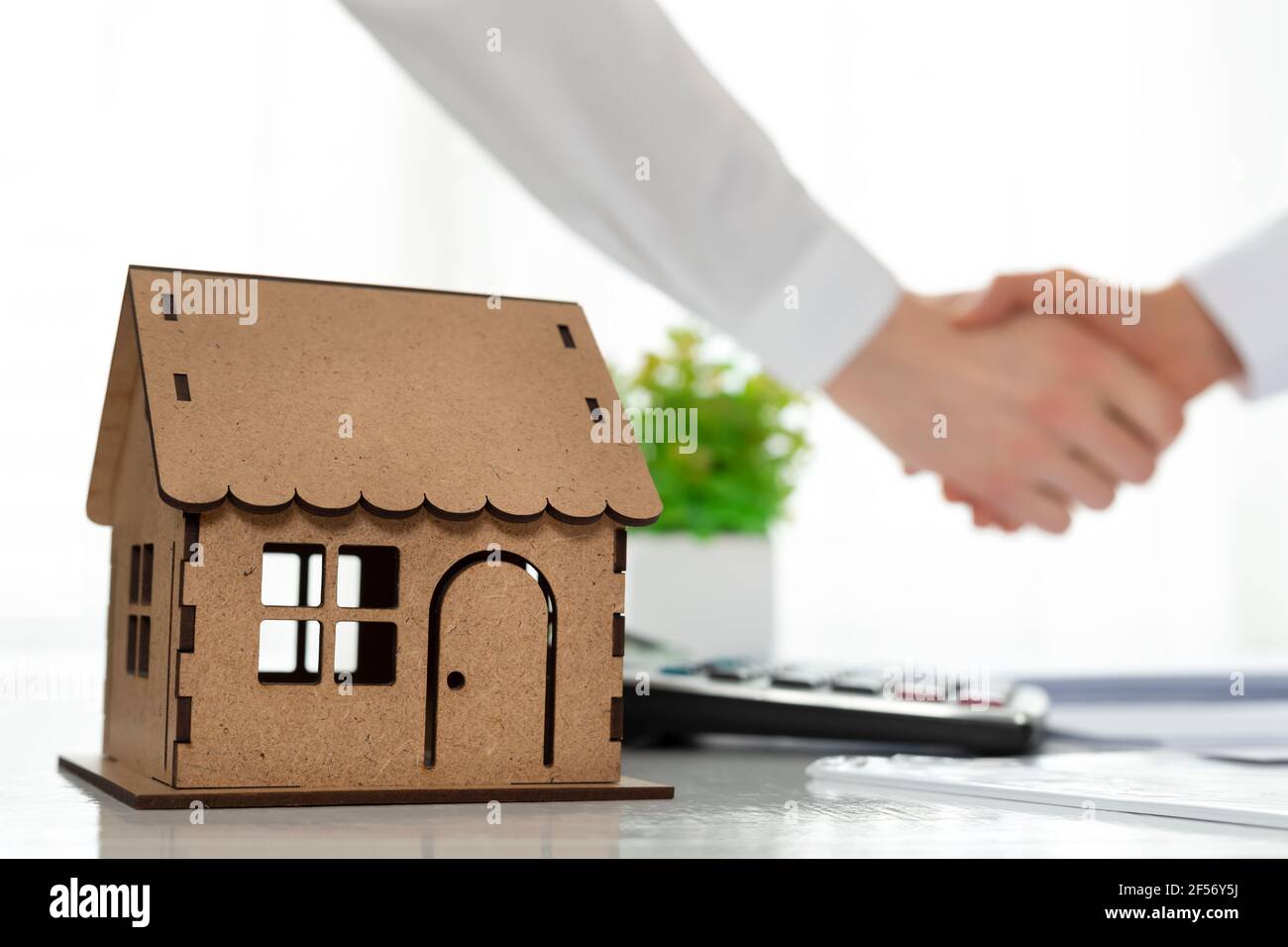 Handshake after an agreement to buy or rent a house. Stock Photo