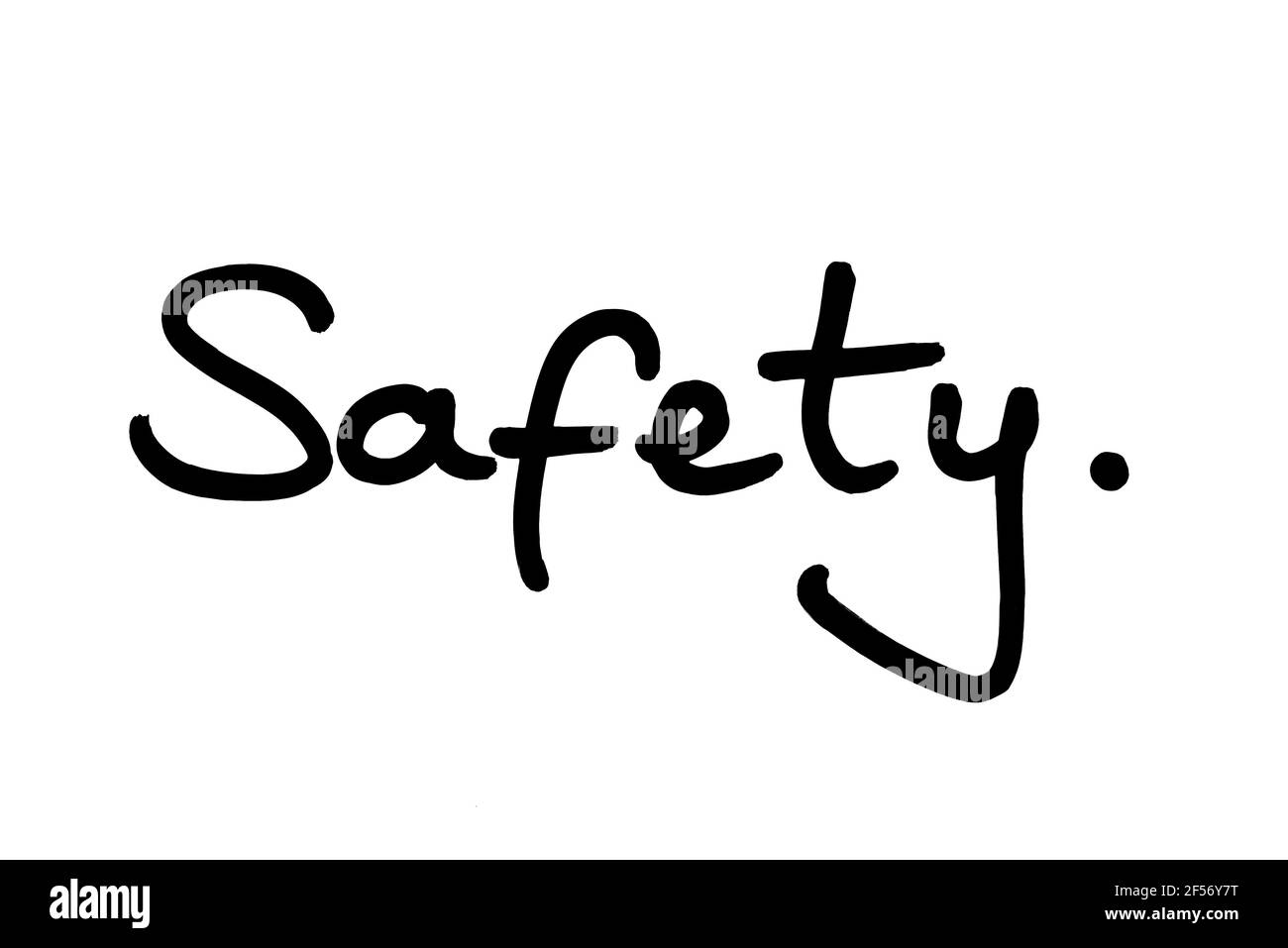 Safety, handwritten on a white background. Stock Photo