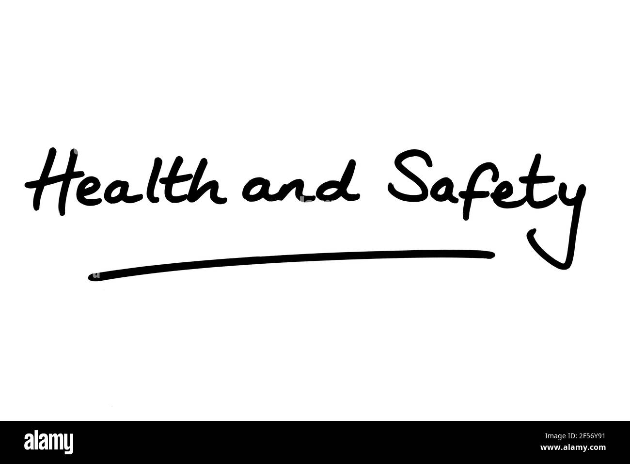 Health and Safety, handwritten on a white background. Stock Photo