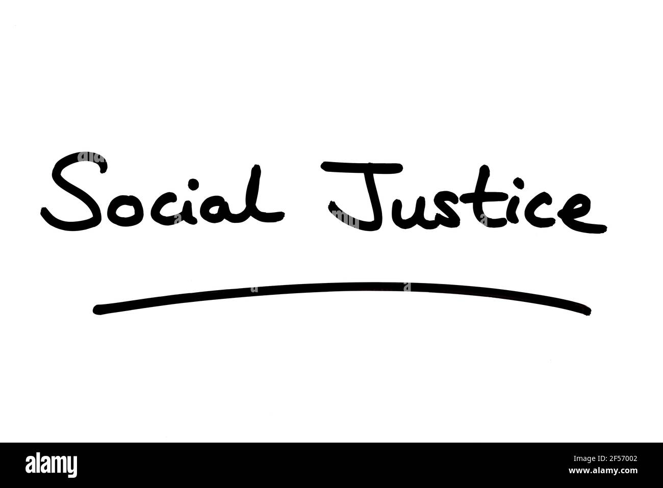 Social Justice, handwritten on a white background. Stock Photo