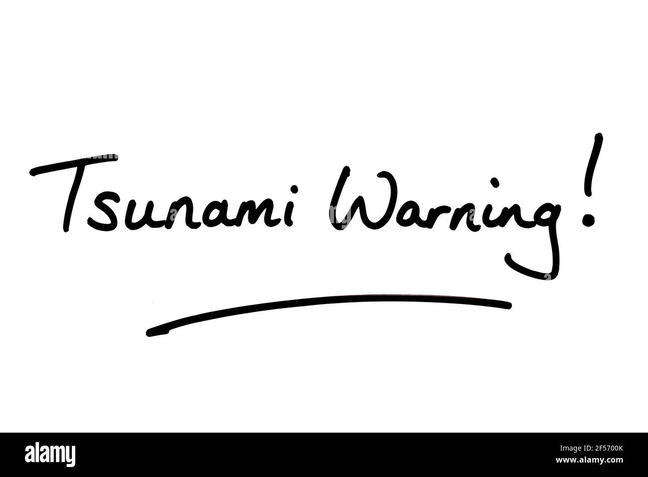 Tsunami Warning! handwritten on a white background. Stock Photo