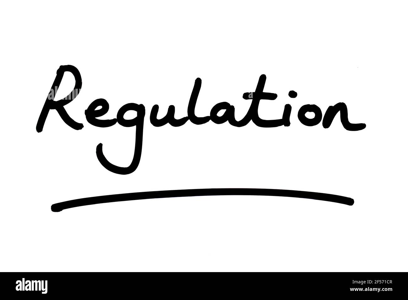 Regulation, handwritten on a white background. Stock Photo