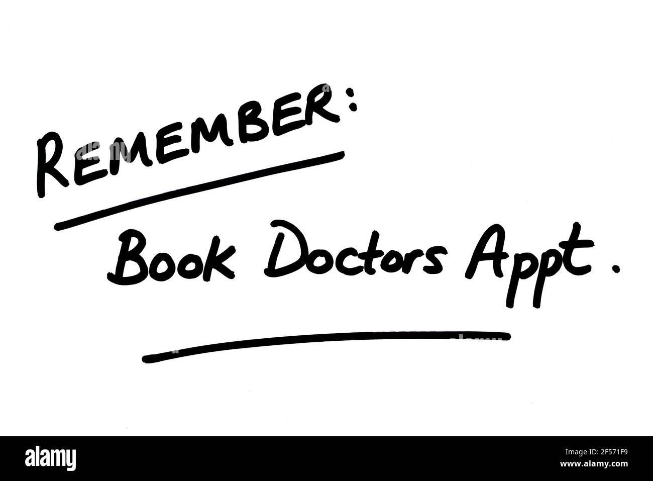 Remember - Book Doctors Appt, handwritten on a white background. Stock Photo
