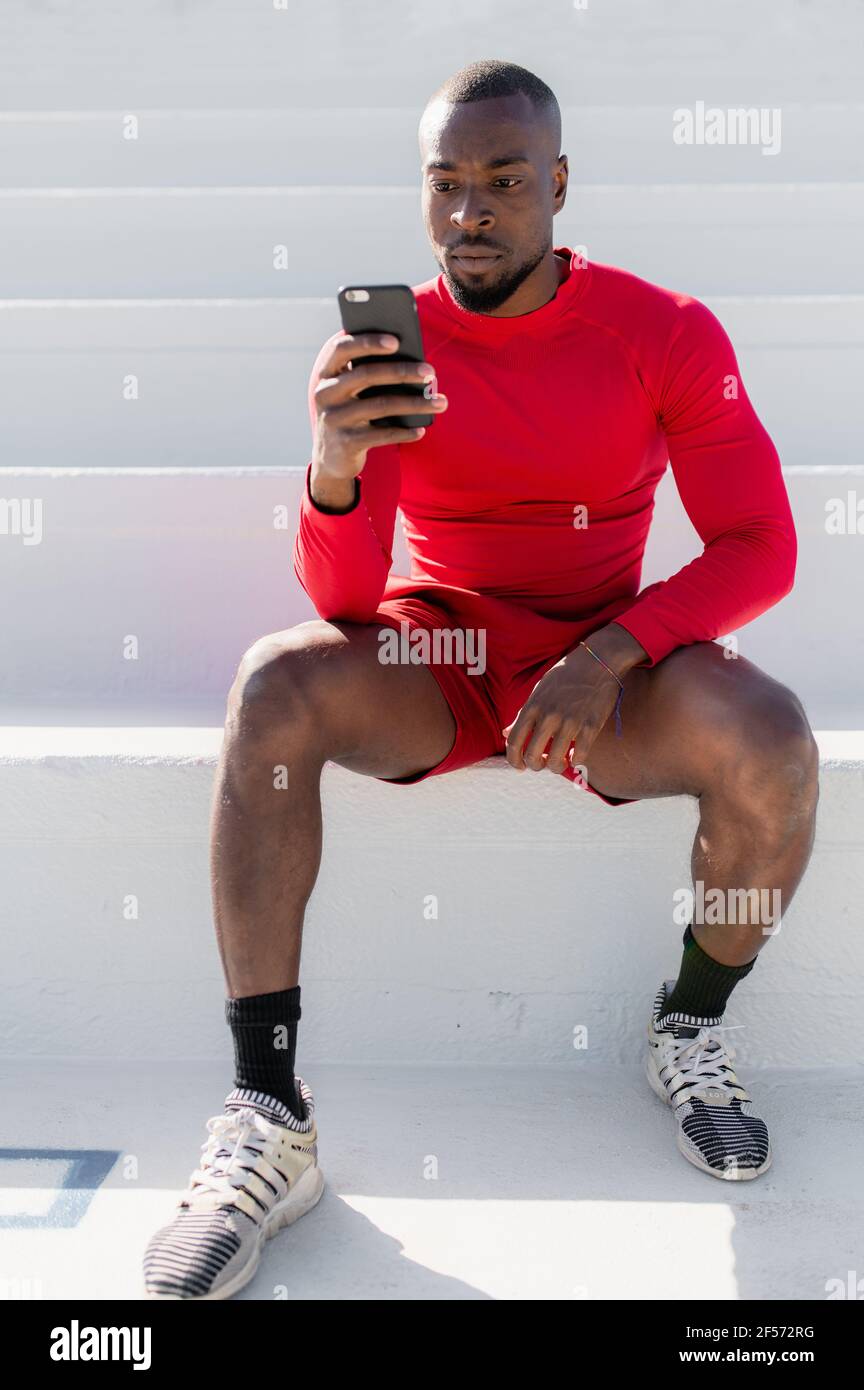 Vertical close-up of black African muscular man with sportswear 