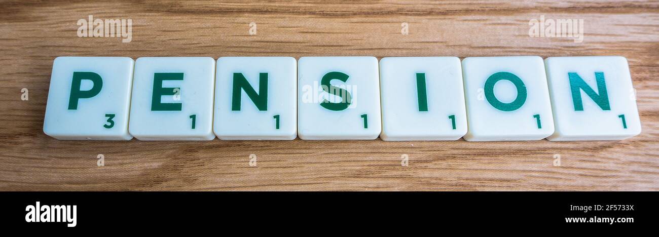 Pension fund saving word letter on scrabble tiles Stock Photo