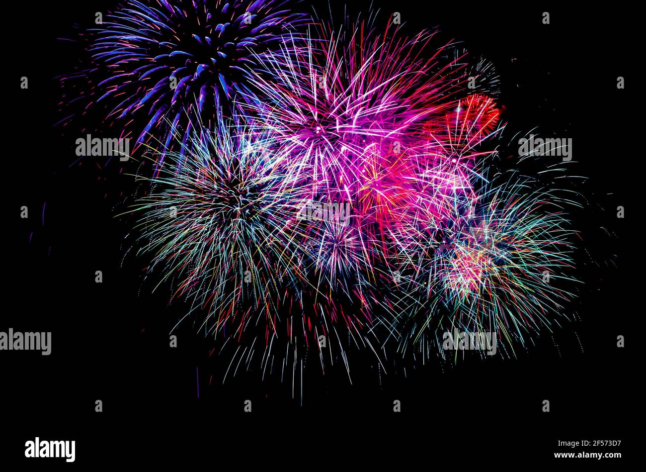 Fireworks in the dark night sky - black background Stock Photo