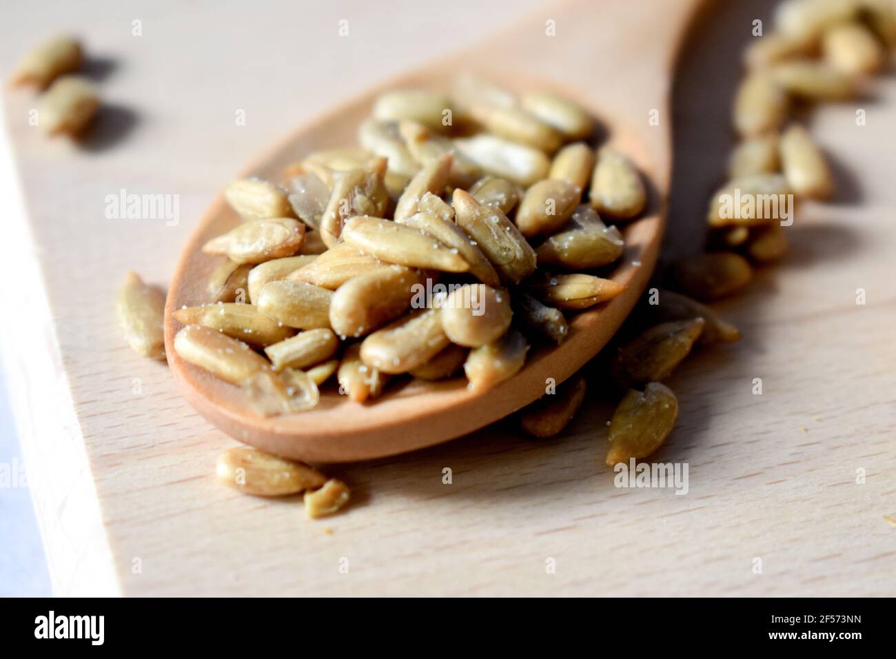 Sunflower seeds in a wooden spoon Stock Photo