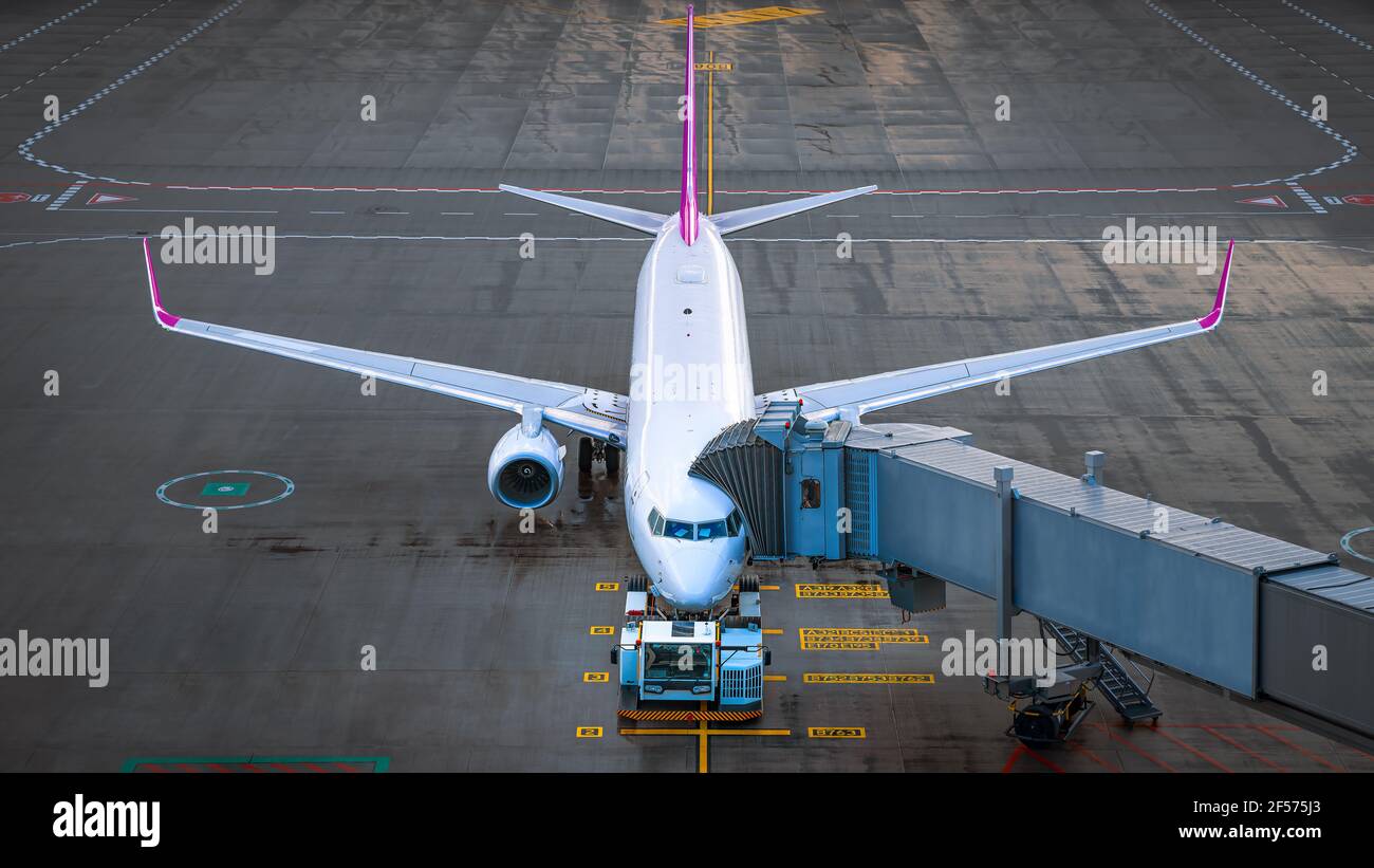 modern airplane while boarding at the airport Stock Photo