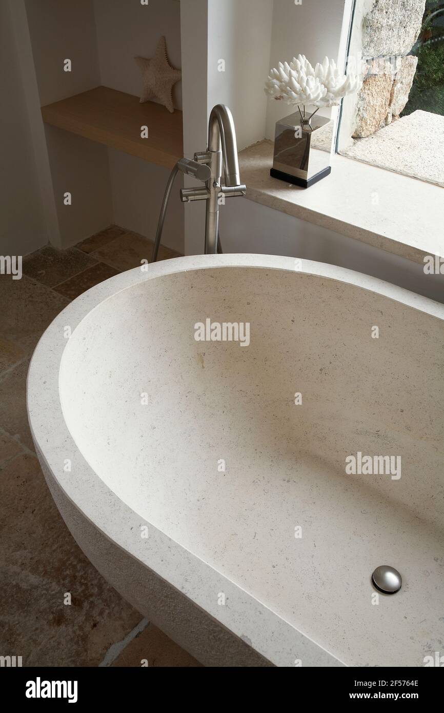 Nice bathtub made in stone in a private house Stock Photo