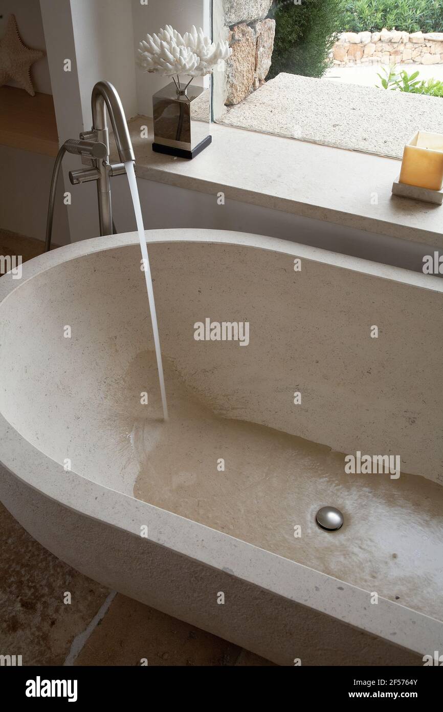 Nice bathtub made in stone in a private house Stock Photo