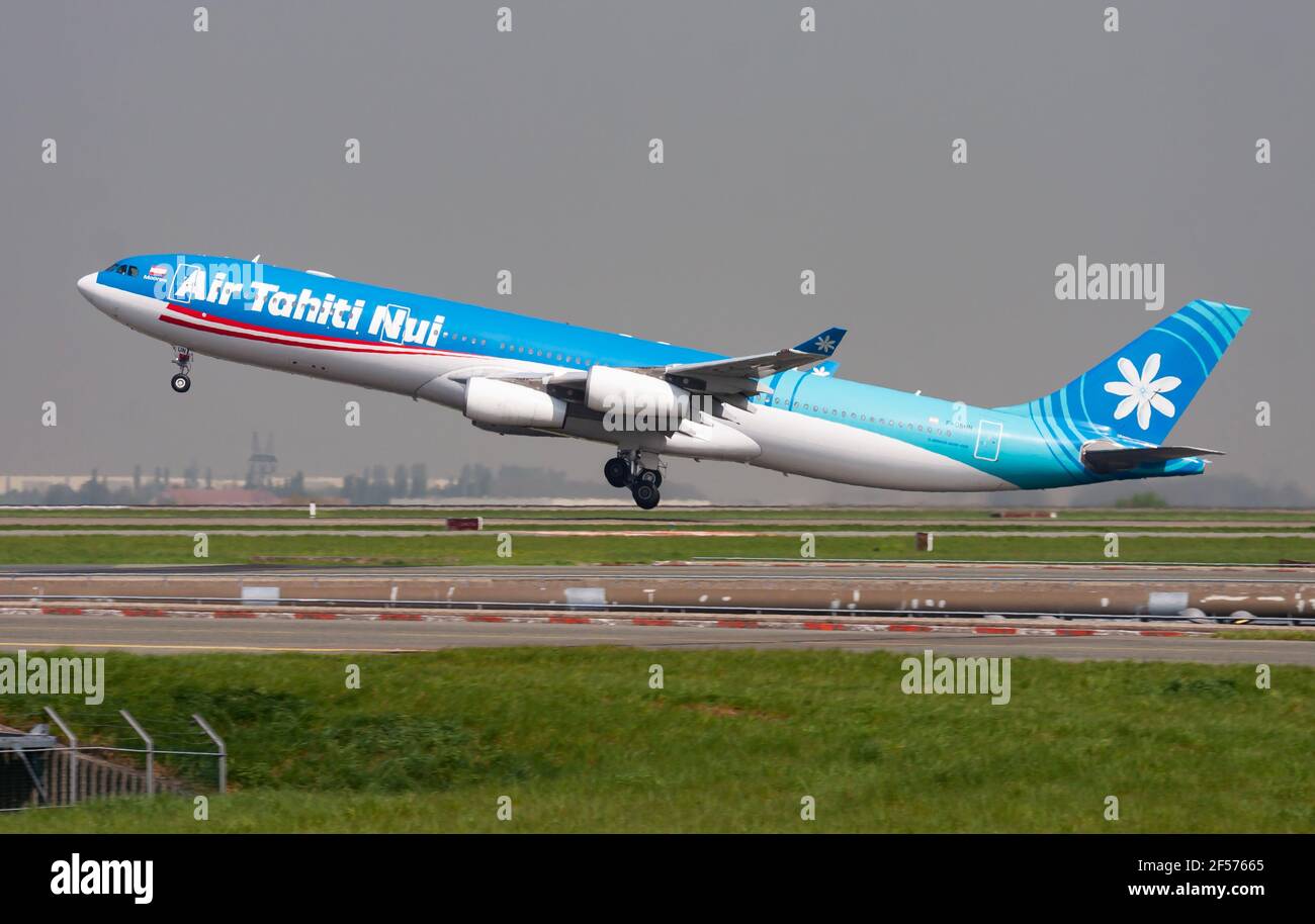 Air Tahiti Nui Airbus A340-300 F-OSUN passenger plane departure and take off at Paris Charles de Gaulle Airport Stock Photo