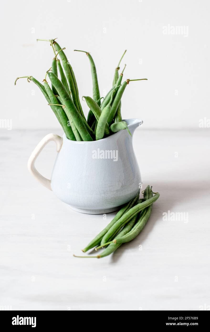 Organic French Beans against a simple plain background Stock Photo
