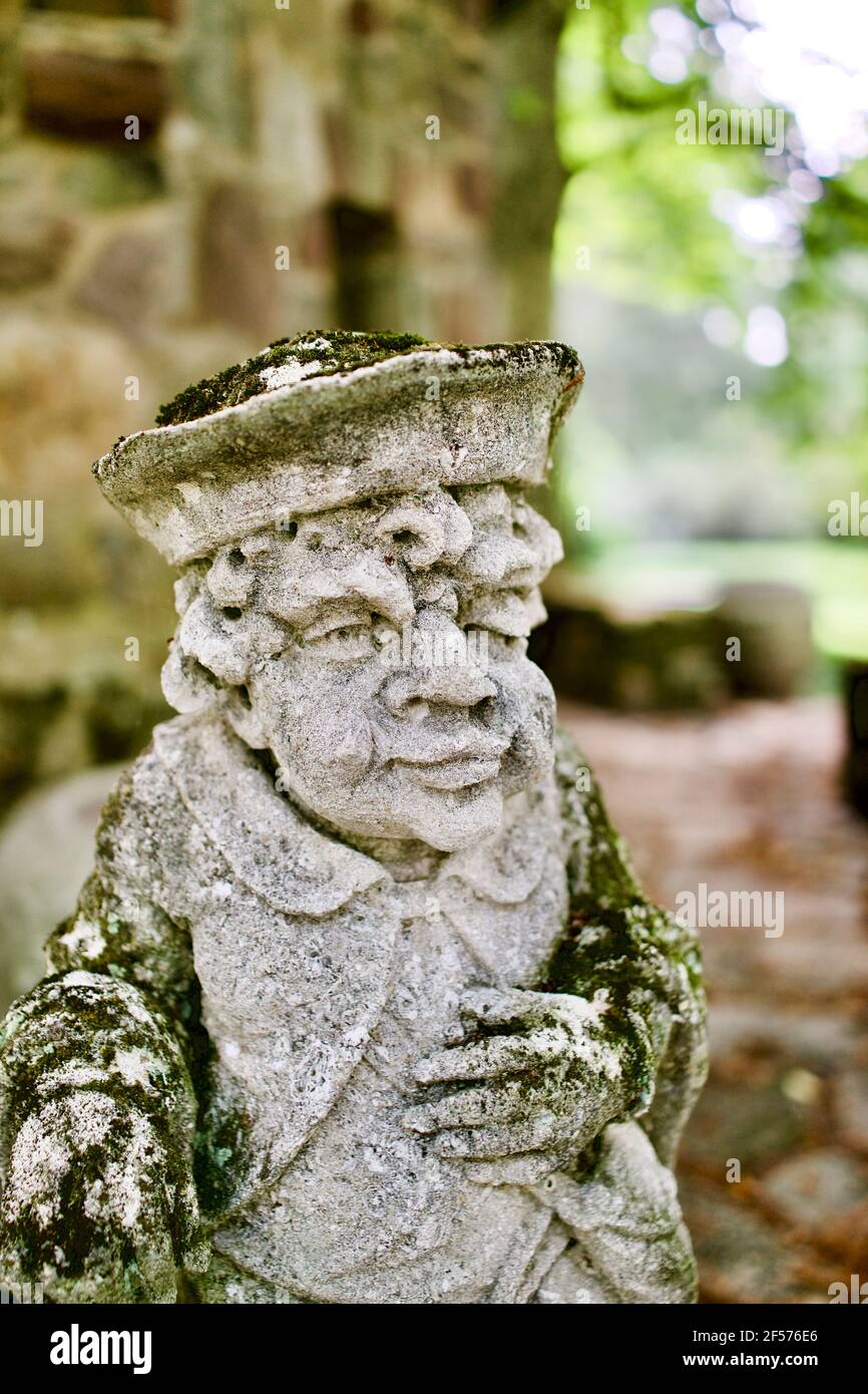 Moss covered statues at Greenwood Gardens in Millburn, NJ, USA.  These are actually large Limestone chess pieces purchased by Peter P. Blanchard Jr. Stock Photo