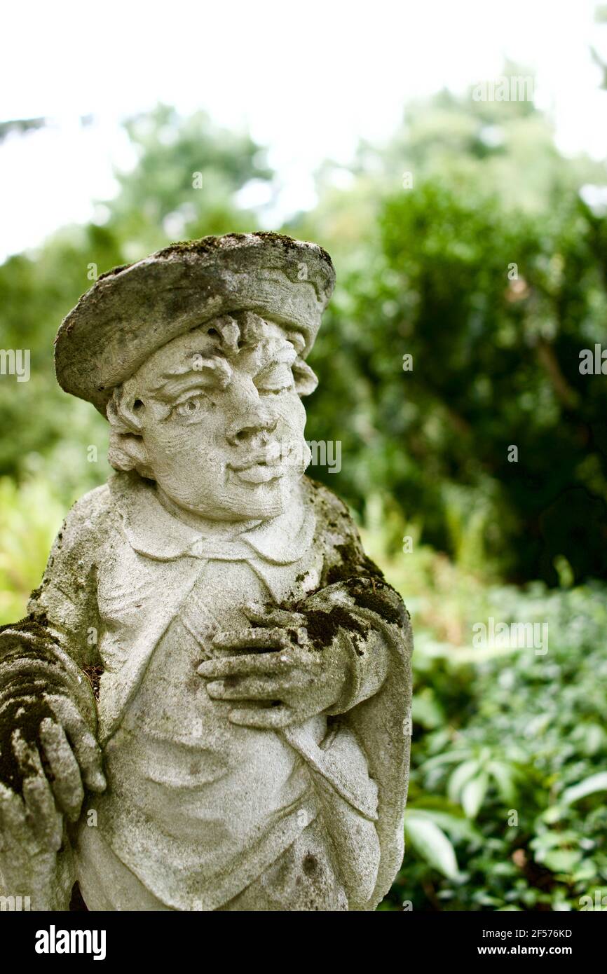 Moss covered statues at Greenwood Gardens in Millburn, NJ, USA.  These are actually large Limestone chess pieces purchased by Peter P. Blanchard Jr. Stock Photo