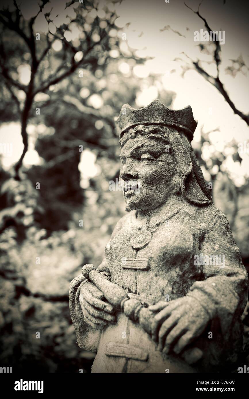 Moss covered statues at Greenwood Gardens in Millburn, NJ, USA.  These are actually large Limestone chess pieces purchased by Peter P. Blanchard Jr. Stock Photo