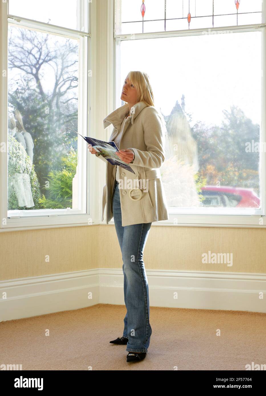 Woman viewing property Stock Photo