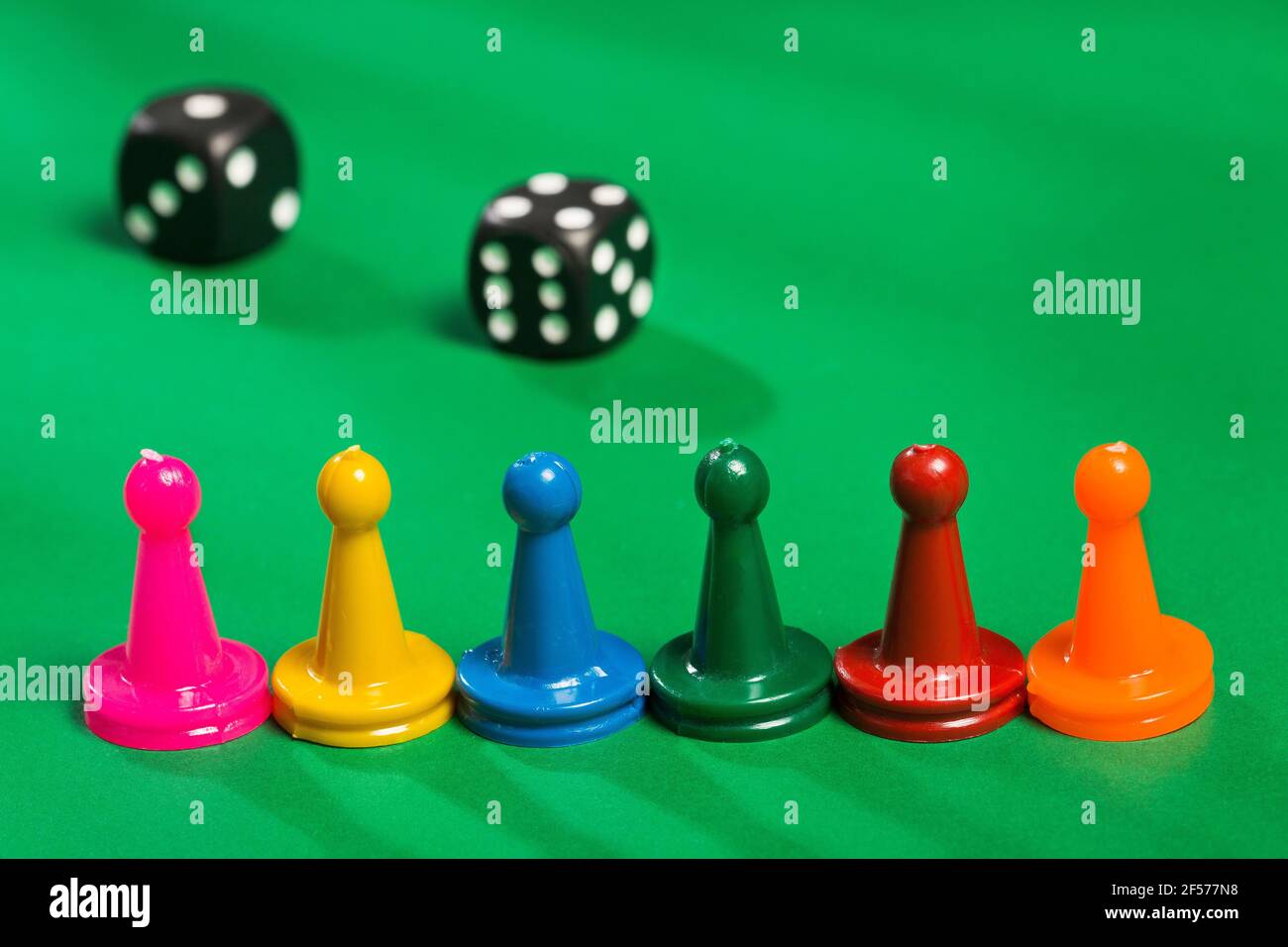 Colorful game pieces and dice Stock Photo Alamy