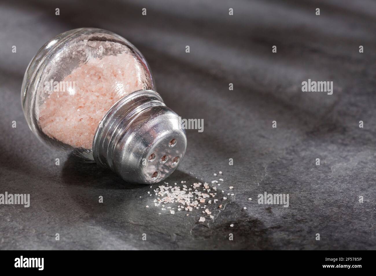 Fine grains of pink Himalayan salt, powder red rock salt from Pakistan
